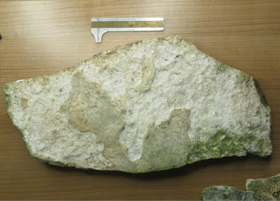 Tabular Flint Anvil: Plate flint anvil showing prepared striking surface and scar pattern